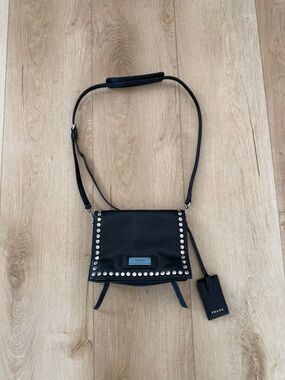 Prada Studded Etiquette Flap Leather Bag.